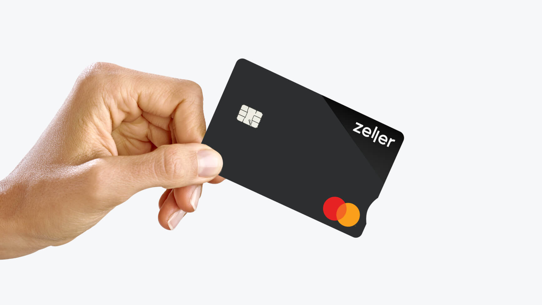 hand holding Zeller business debit card black